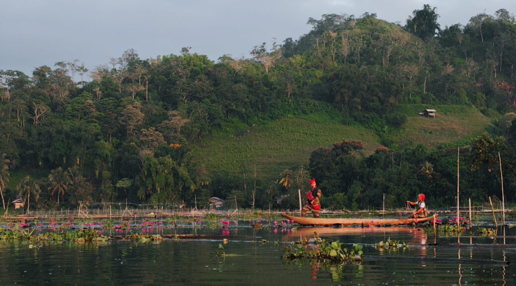 Tboli tribesmen amidst the natural beauty of Lake Sebu