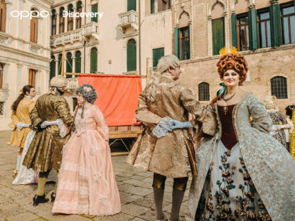(People dancing in the square in the costumes, shot on OPPO Reno 13 Pro 5G)