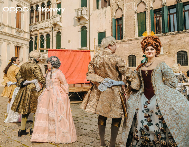 (People dancing in the square in the costumes, shot on OPPO Reno 13 Pro 5G)